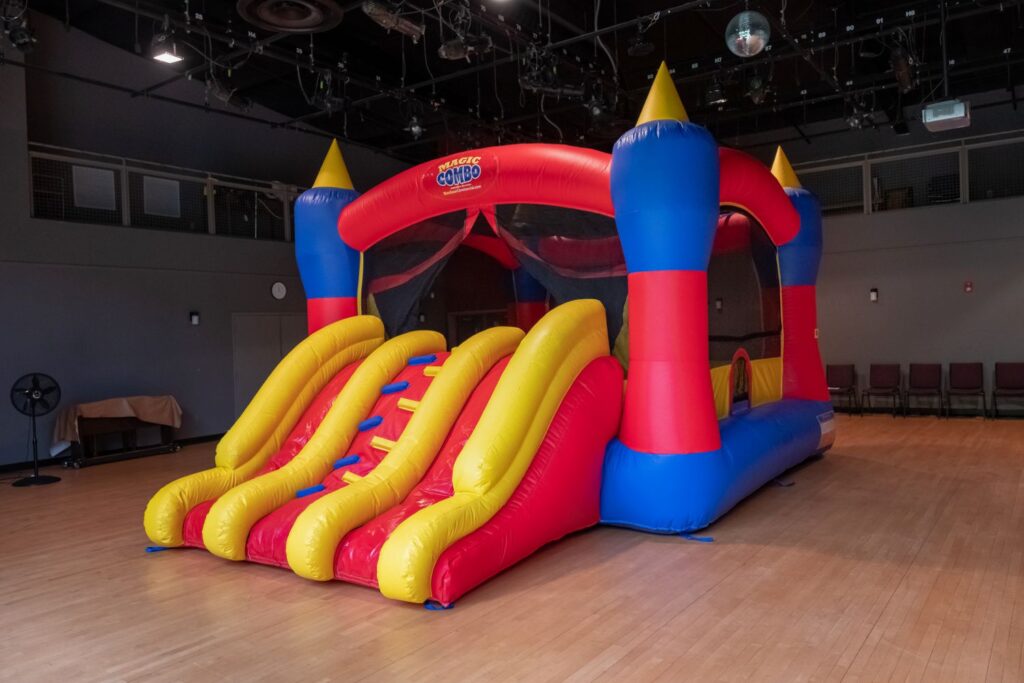 An inflatable bounce house and attached slide